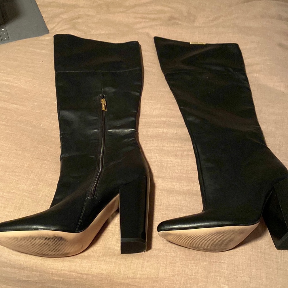 Knee high black Calvin Klein heeled boots